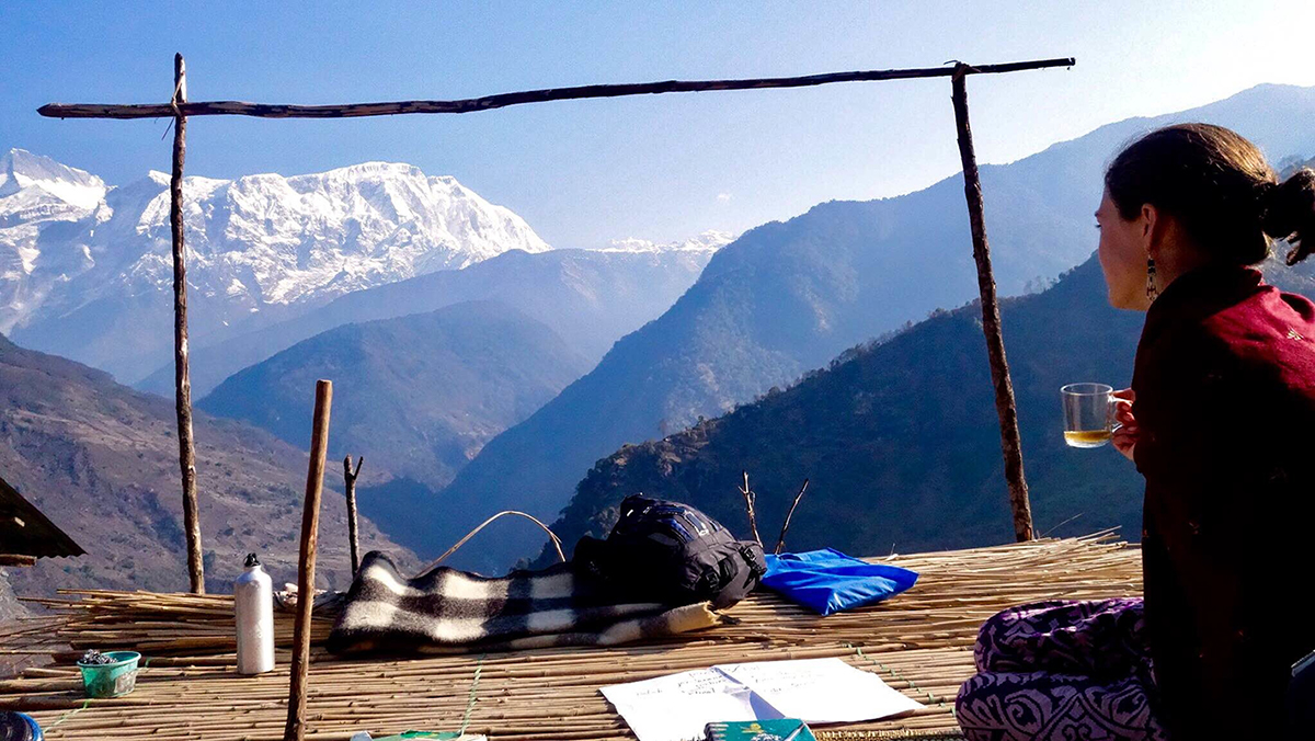A CMC study abroad student enjoys a view of the mountains while studying