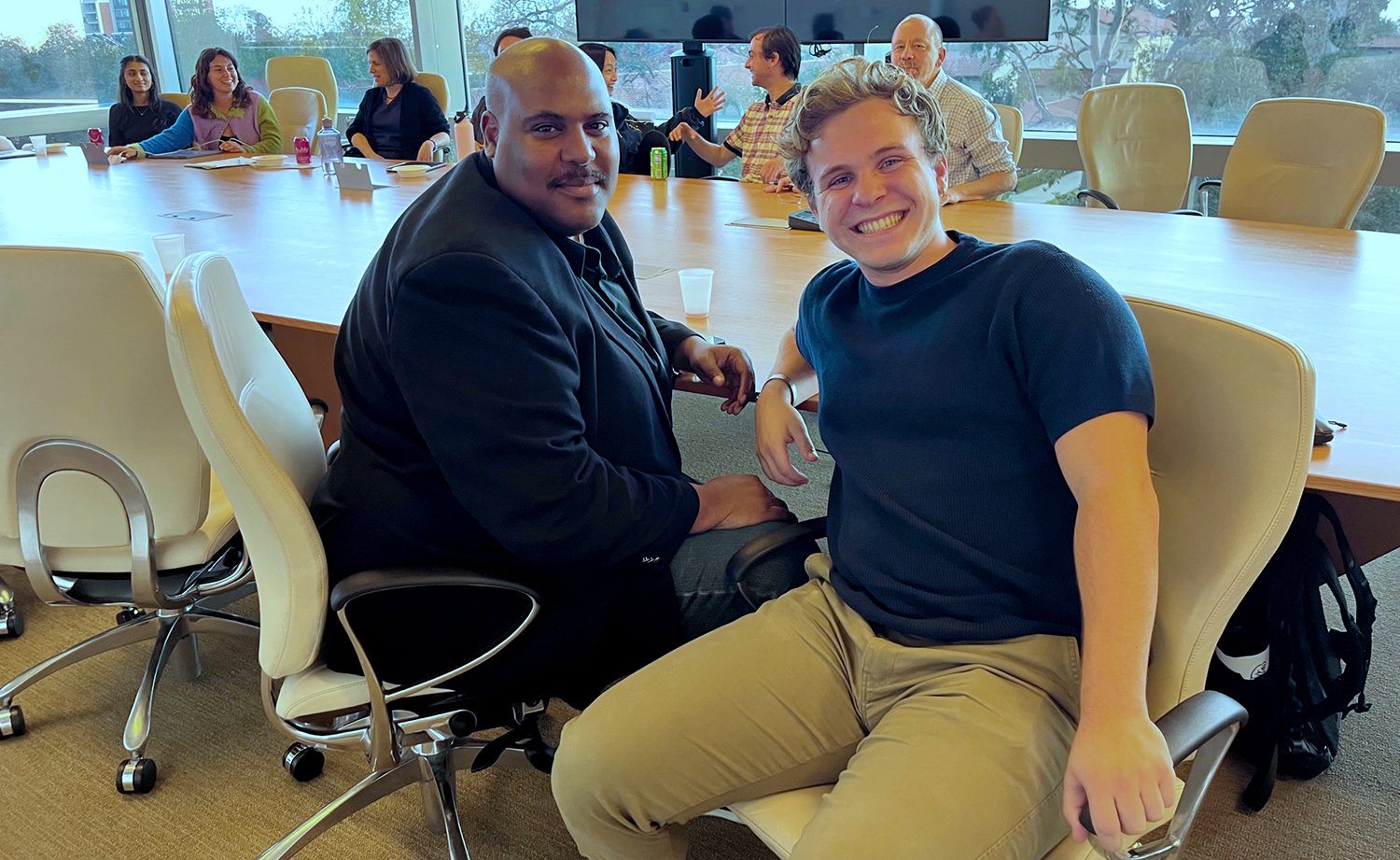 A student posing with Professor Michael Fortner.