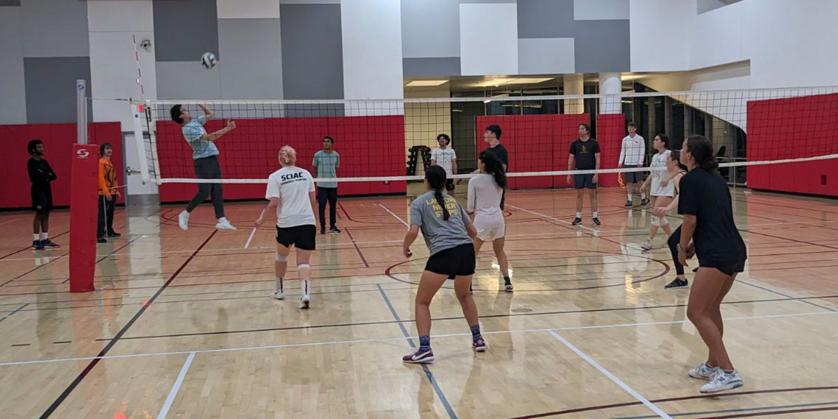 Students playing intramural volleyball.