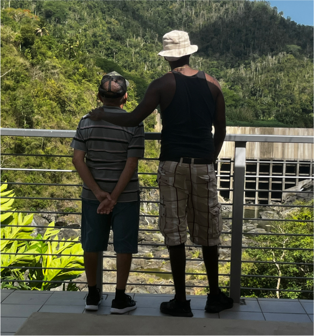 Two men looking out at the outdoors.