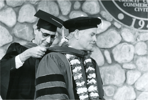 Robert Day receiving sash at Commencement.