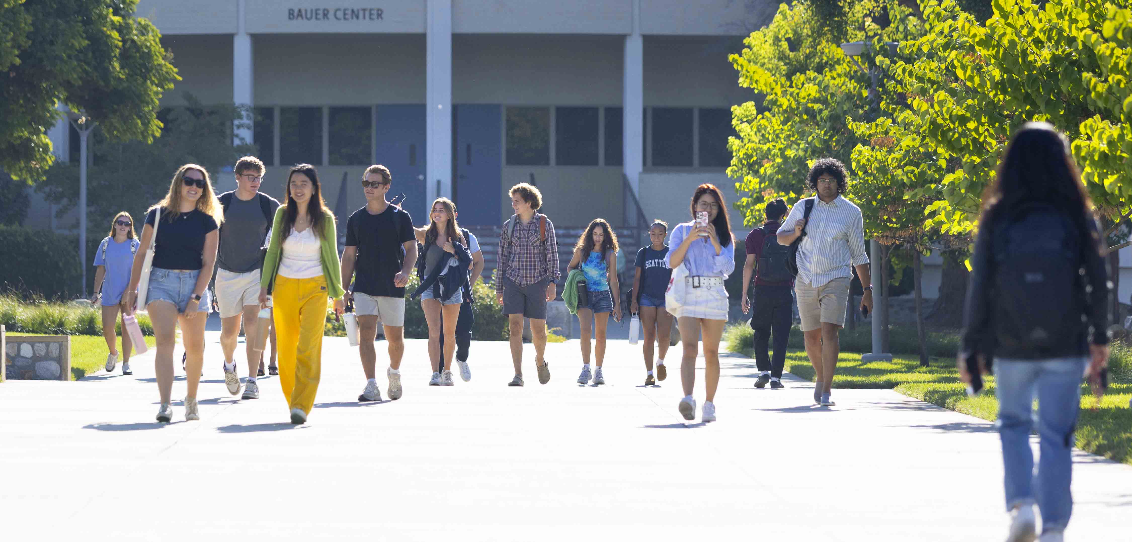 Students walking in front of Bauer Center on the first day of classes, Fall 2024.