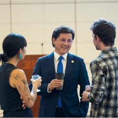 Nury Turkel speaking with others at the CMC Athenaeum. 