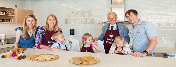 Valach family inside Janie's Kitchen during Valach Hall dedication.