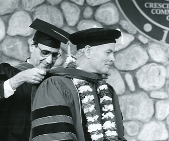 Robert Day receiving sash at Commencement.