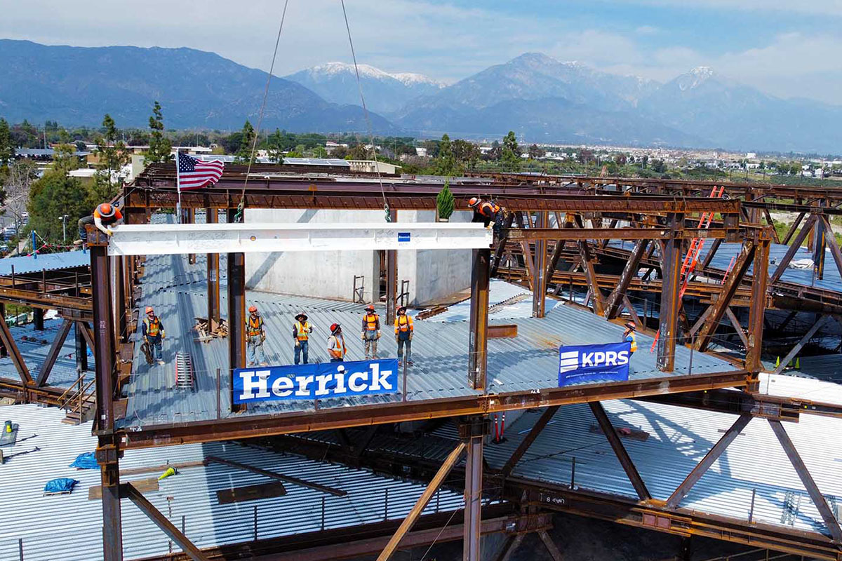 The last steel beam being addd to the Robert Day Sciences Center.