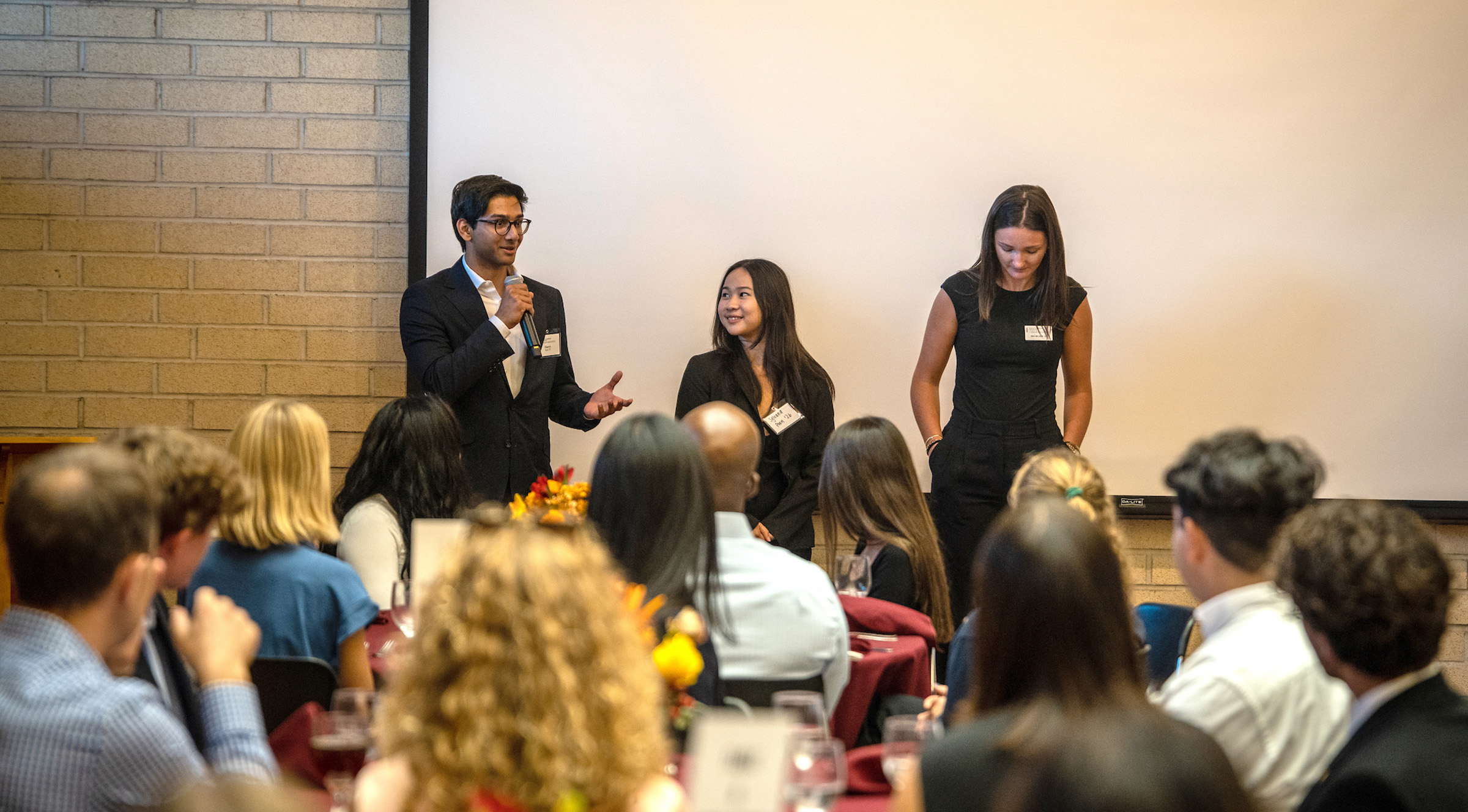 Students presenting at a KLI event.