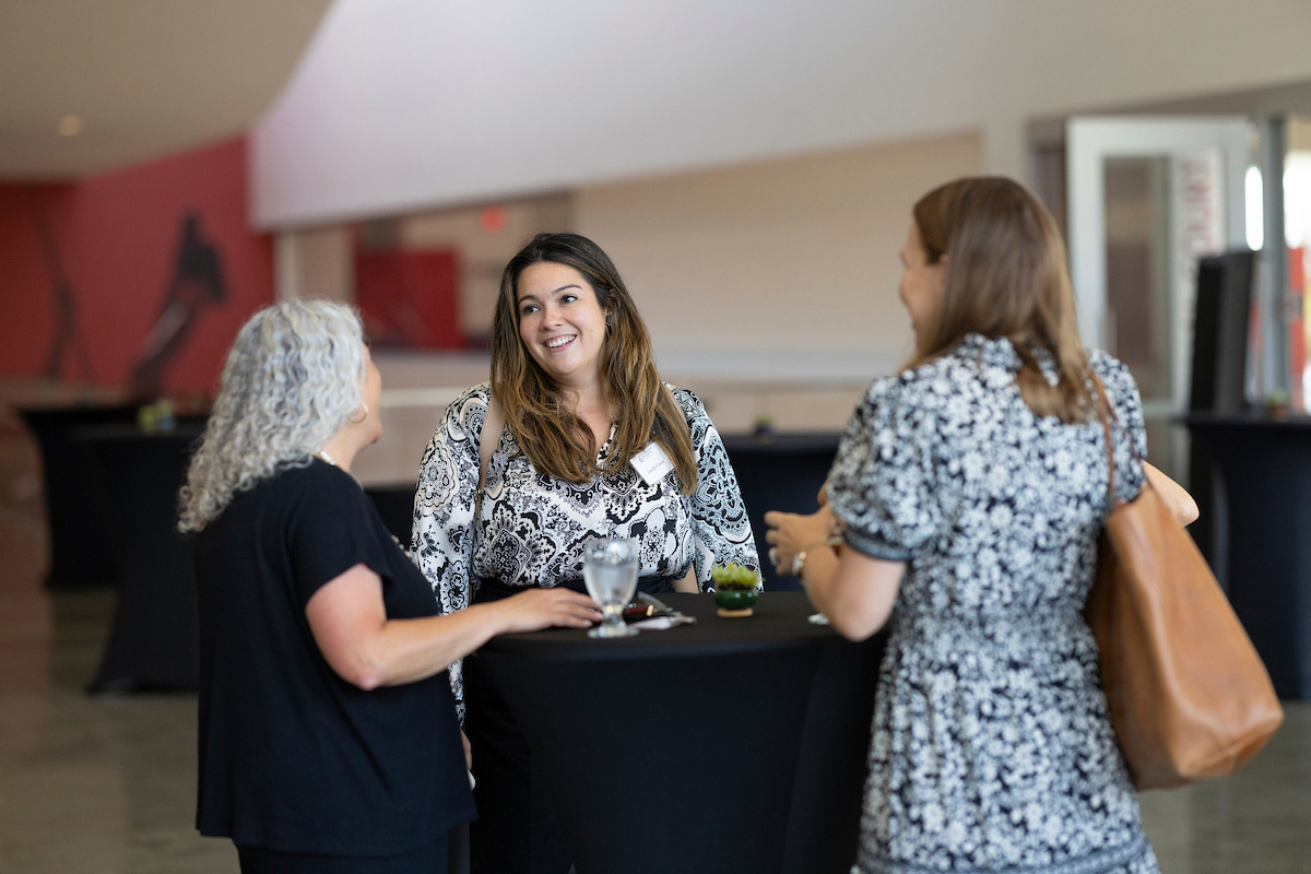 The Dean of Faculty Heather Antecol (left) and two faculty members at the 2025 faculty reception.