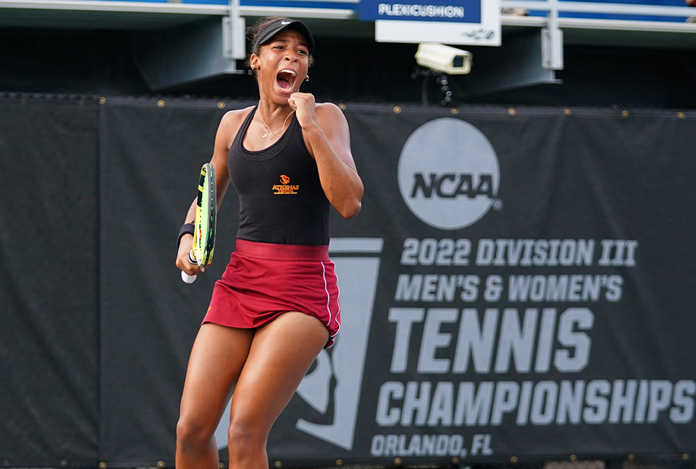 Ella Brissett '25 celebrating her win on the tennis court.