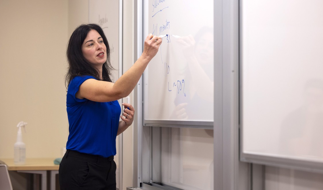 Professor Lisa Koch in front of her class.