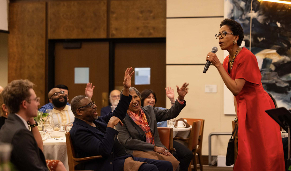 Dr. Diane White-Clayton in front of audience in the Ath