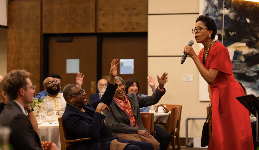 Dr. Diane White-Clayton in front of audience in the Ath