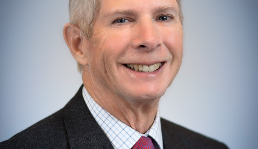 Present day Dale Jacobs '66 in suit and tie.