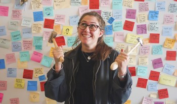 Anya Zimmerman-Smith '21 poses by a colorful iteration of her Honor Project