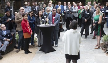 Faculty with friends and family at retirement party.