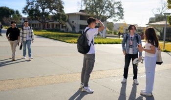 Campus shot of students going to class.