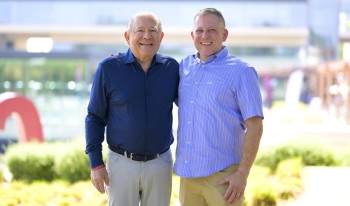 Les '75 &amp; Eric '05 Weisbrod standing together on campus