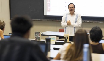 Prof. Salvador Velazco speaking in front of class