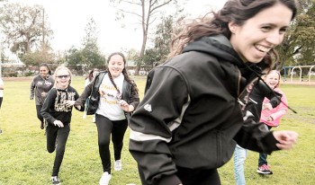 CMS softball players with elementary students