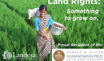 Woman tending land with Landesa support