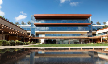 Upward shot of Kravis Center with the Massoud water feature in view.