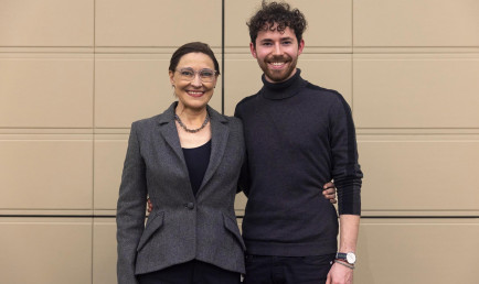 Stephanie Kleine-Ahlbrandt P’25  standing with her son, Adrian Flynn '25