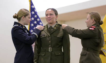 Cooper McKenna having her rank pinned on uniform