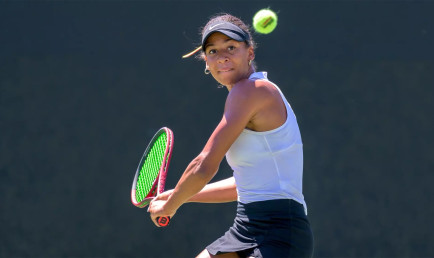 Ella Brissett '25 hitting tennis ball