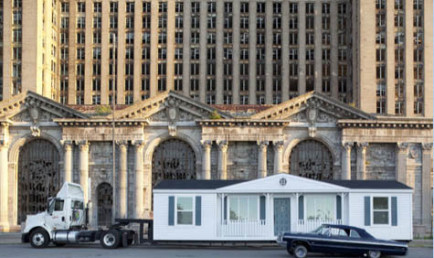 Mike Kelley's Mobile Homestead in front of the abandoned Detroit Central Train Station.