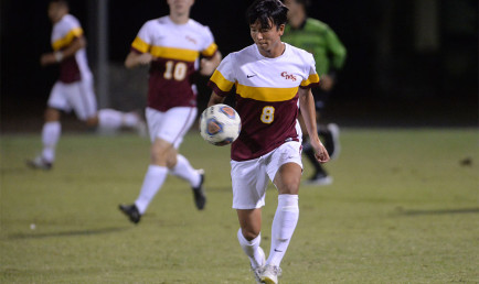 CMS men's soccer player Yusuke Kobayashi with the ball