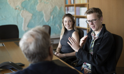 Students participating in a seminar on capitalism